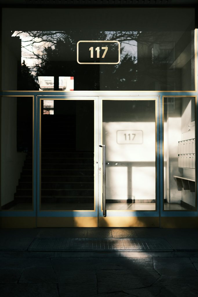 a building with a number sign on the door